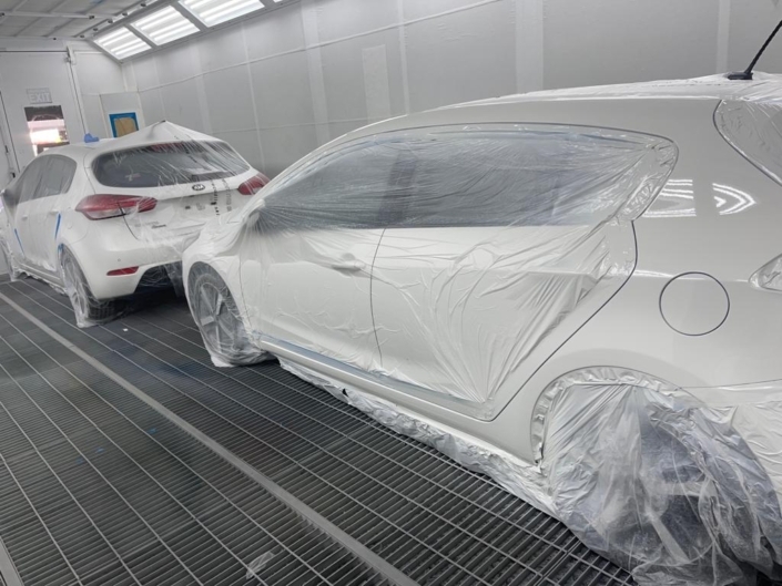 Two Cars in Spray Booth